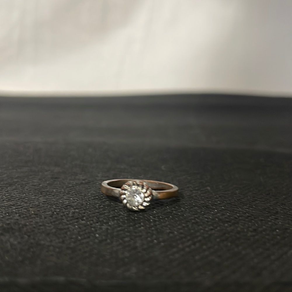 Small ring with a white gem